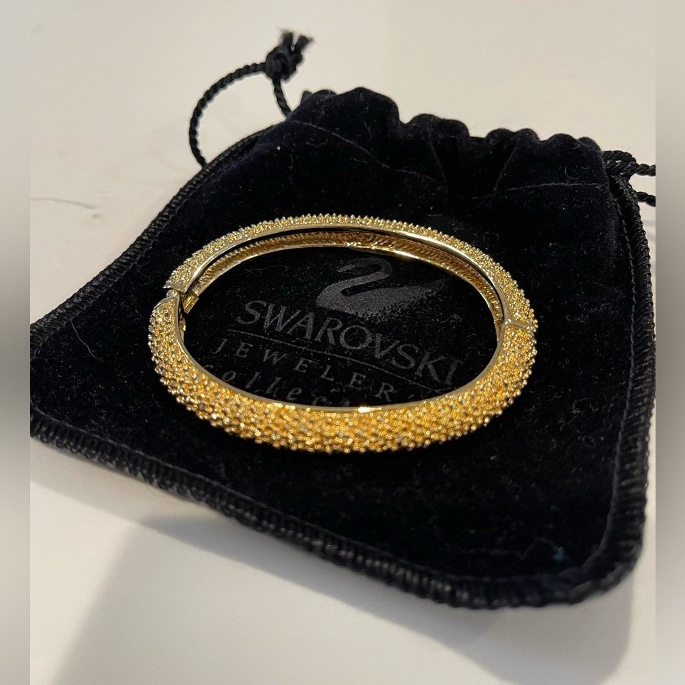Swarovski gold tone crystal encrusted hinged bangle